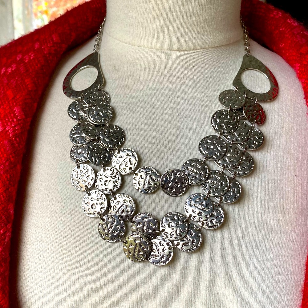 Erica silver tone hammered metal necklace. Total length 22”. Triple layers.